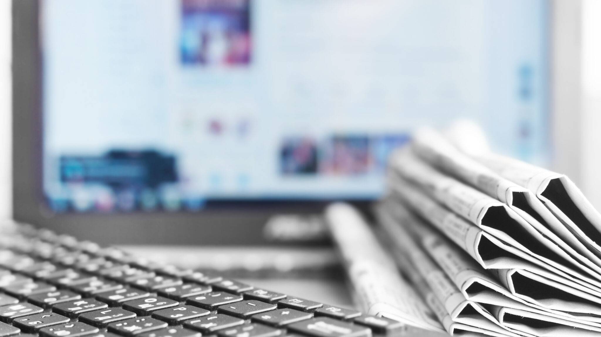 Newspapers and Laptop. Different Concepts for News - Network or