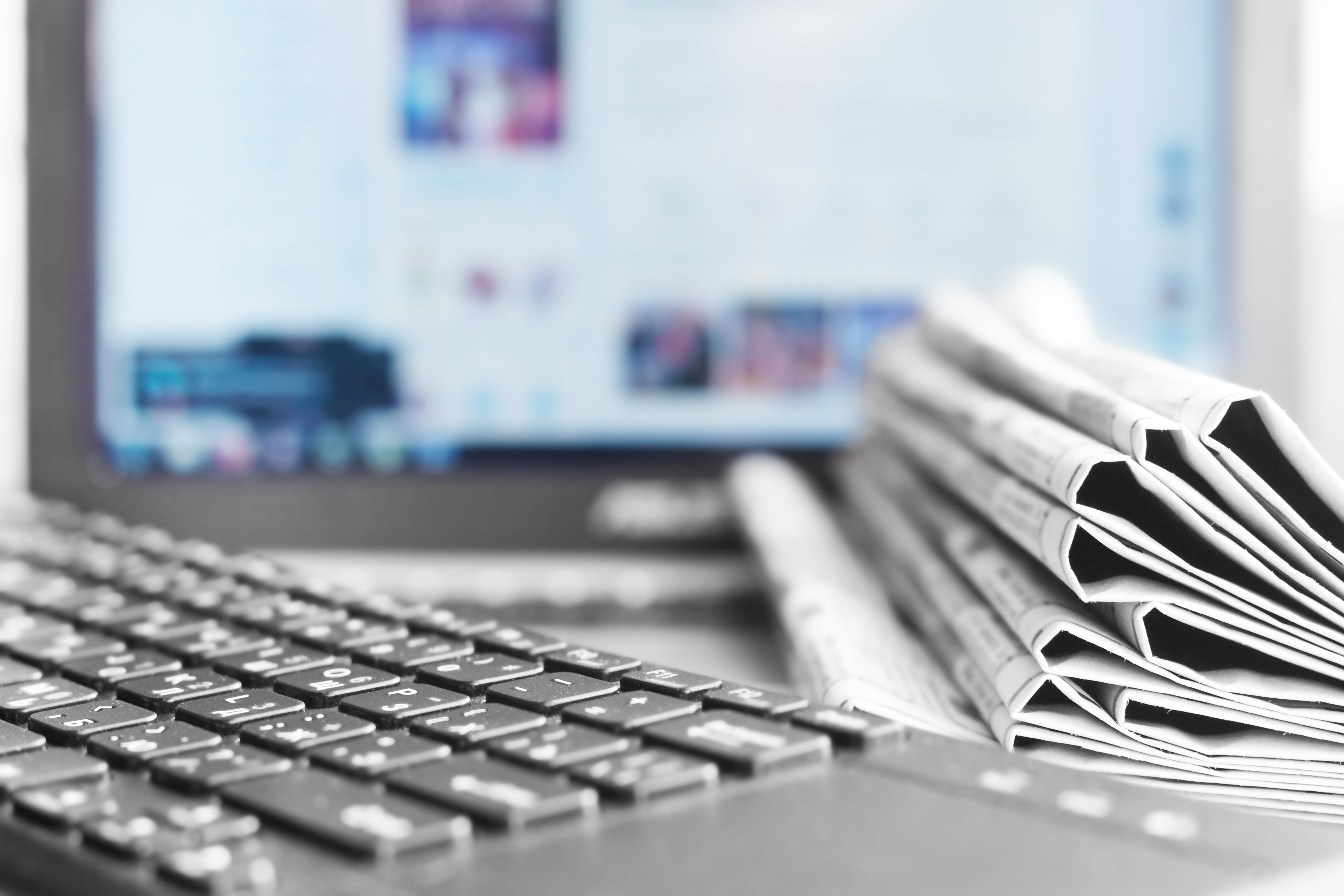 Newspapers and Laptop. Different Concepts for News - Network or